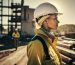 Portrait of a female construction worker on the background of a construction site.